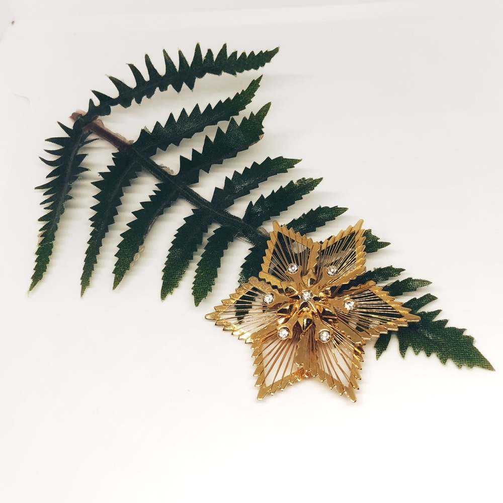 Gold covered metal brooch